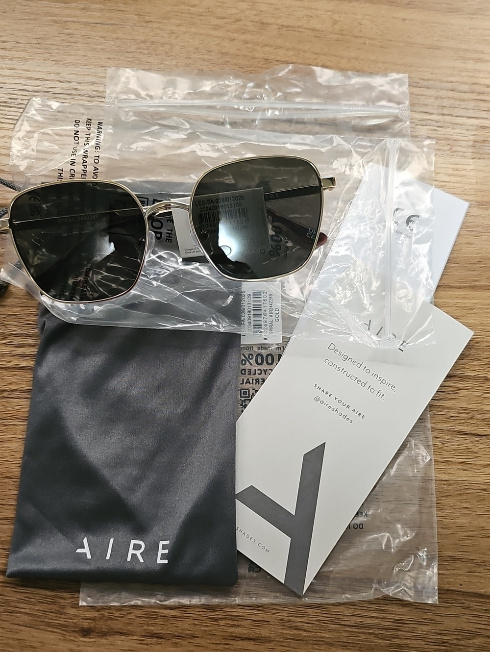 AIRE Womens Gold Frame Sunglasses with Dark Lenses
